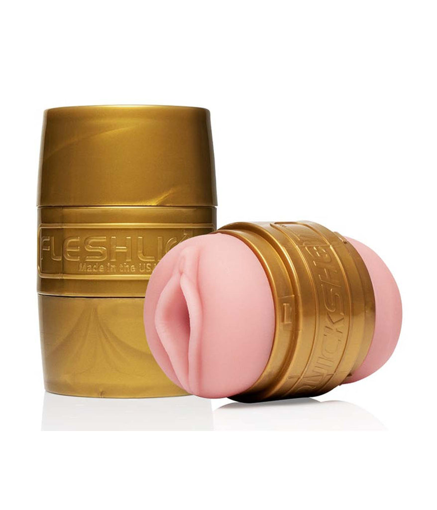 An image of the Fleshlight Quickshot Stamina Training Unit. This product shot shows 2 Fleshlight Quickshot Stamina Training Units, an open one laying on its side showing the Lady (vagina) orifice and the other Fleshlight Quickshot closed standing upright.